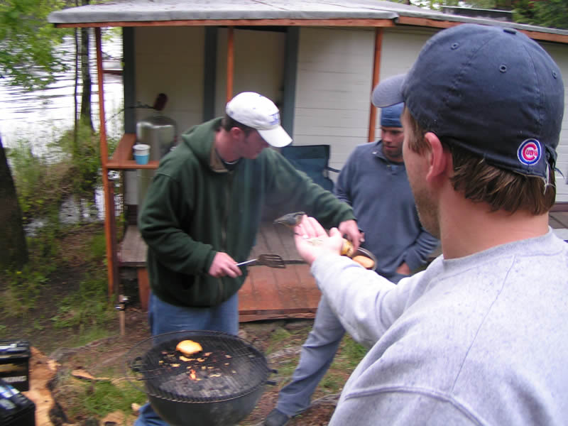 hand feeding a red breasted nuthatch